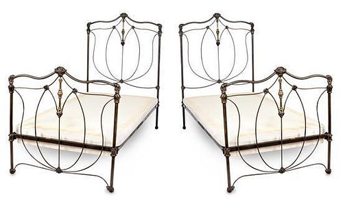 A Pair of Victorian Style Patinated Iron and Brass Twin Bedsteads Width 39 inches.