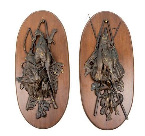 A Pair of Cast Metal Wall Plaques Height 30 inches.