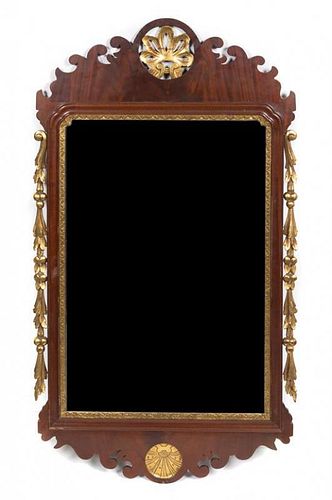 * A Chippendale Style Mahogany and Parcel Gilt Mirror. Height 45 x width 26 1/2 inches.
