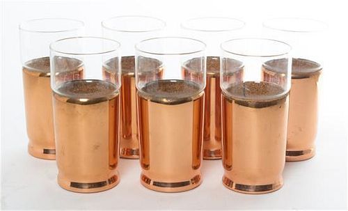 * A Group of Seven Copper Cups Height 6 inches.