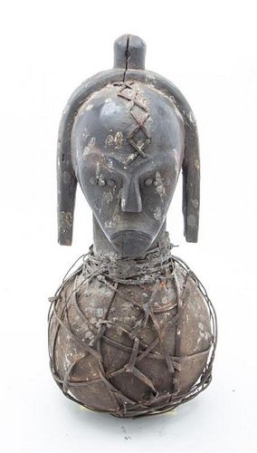 * An Ethnographic Carved Wood and Metal Figure Height 19 3/4 inches.