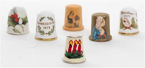A Collection of Holiday Themed Thimbles Height of tallest 1 inch.