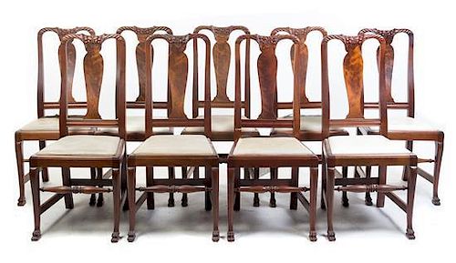 * A Set of Twelve Carved Mahogany Side Chairs Height 41 inches.