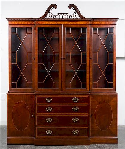 A Baker Mahogany Breakfront Bookcase Height 93 1/2 x width 75 x depth 14 3/4 inches.
