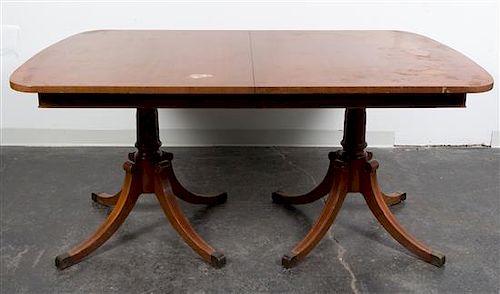 A Georgian Style Double Pedestal Table Height 29 3/4 x length 64 x depth 42 inches.
