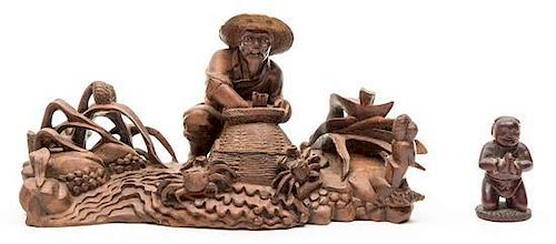 A Carved Wood Figure of a Fisherman Height of taller 10 inches.