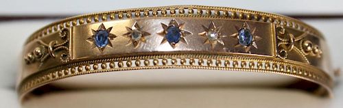 Victorian 10k yellow gold bangle having 2 old mm cut rd diamonds and 3 rd cut sapphires in star sett