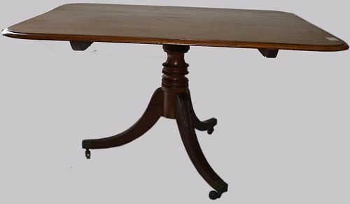 Regency mahogany tilt-top breakfast table with pedestal base. Top 40" x 51".