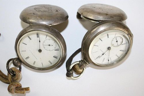 Two open face coin silver American Watch Co. pocket watches. One key wind.