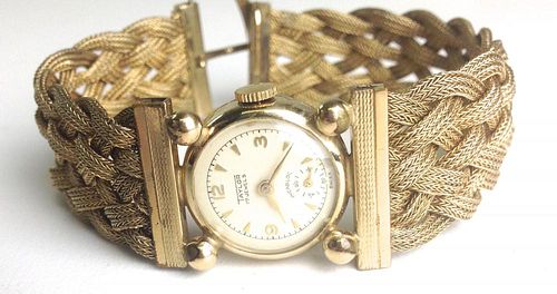 Taylor 17 jewel ladies 10k y.g. wrist watch with woven gold wire band. 7¾"l, ¾"w.