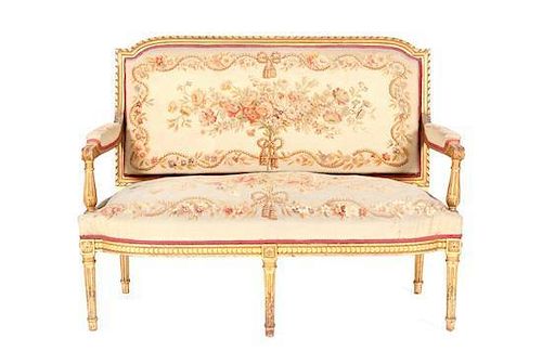 A Five-Piece Louis XVI Style Carved Giltwood Parlour Suite, Height of first 41 x width 54 x depth 23 1/4 inches.