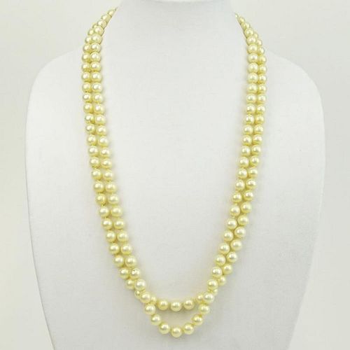 Vintage 9.50-9.60mm White Pearl Double Strand Necklace with 14 Karat Gold and Diamond Clasp.