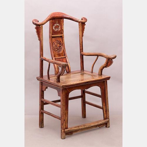 A Chinese Hong Mu Style Carved Elm Armchair, 20th Century.
