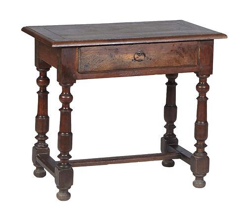 French Provincial Louis XIV Style Carved Walnut Writing Table, 19th c., the stepped rounded edge rectangular top over a frieze drawer, on turned, tape