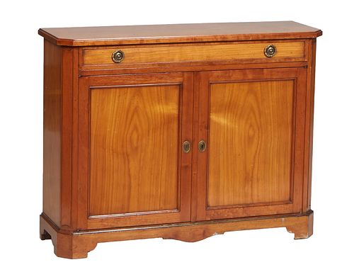 Diminutive English Style Carved Cherry Sideboard, 20th c., the ogee edge canted corner top over a long frieze drawer above setback double cupboard doo