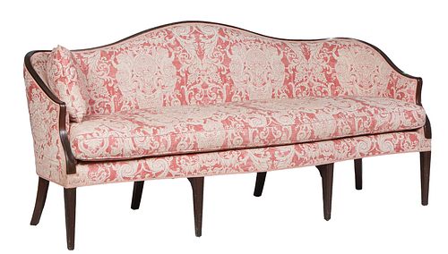 American Carved Mahogany Hepplewhite Style Settee, 20th c., the arched reeded cushioned back to wrap around arms, over a bowed removable cushion seat,