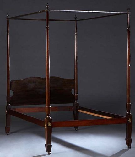 American Carved Mahogany Tester Double Bed, 19th c., the tester on four turned posts on square tapered feet, flanking an arched headboard, to wood rai