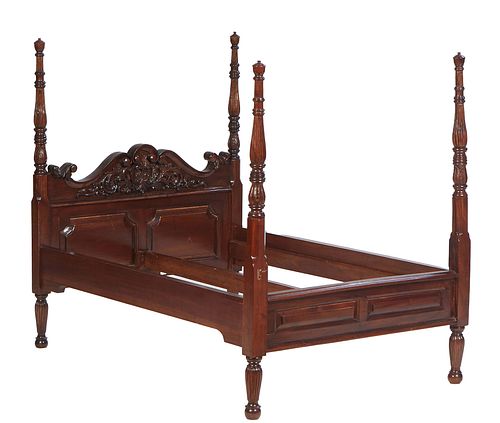 Unusual Infant's Carved Mahogany Poster Bed, 20th c., the arched shell carved headboard flanked by scrolled leaves and reeded acanthus carved cylindri