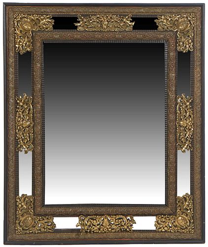 French Brass Overmantel Cushion Mirror, early 20th c., with a repousse leaf and berry frame around rectangular cushion mirrors with pierced brass over
