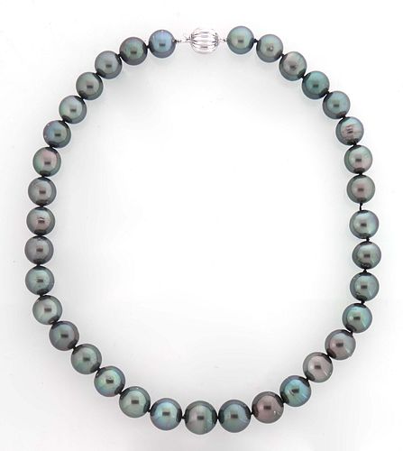 Graduated Strand of Thirty-Five 11-14 mm Dark Gray Tahitian Cultured Pearls, with a 14K white gold ball clasp, L.- 17 1/2 in., with appraisal.