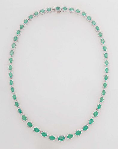 14K Yellow Gold Link Necklace, each of the 48 oval links with a graduated oval emerald atop a border of tiny round diamonds, total emerald wt.- 22.93 