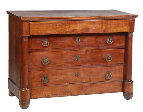 French Empire Ormolu Mounted Carved Walnut Commode, mid 19th c., the rectangular top over a long frieze drawer above three setback deep drawers, flank