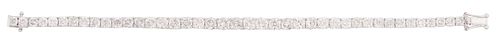 14K White Gold Tennis Bracelet, each of the forty-one links with a graduated round diamond, total diamond wt.- 13.98 cts., L.- 7 1/4 in., with apprais