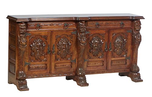 French Renaissance Style Carved Beech Sideboard, 20th c., the stepped breakfront top over two long frieze drawers above two setback high relief grotes