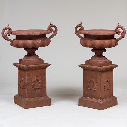 Pair of American Painted Cast Iron Garden Urns on Pedestals
