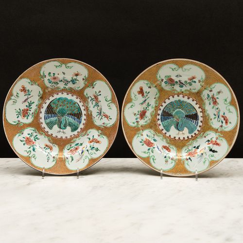 Pair of Chinese Export Famille Rose and Gilt-Ground Porcelain 'Peacock' Plates