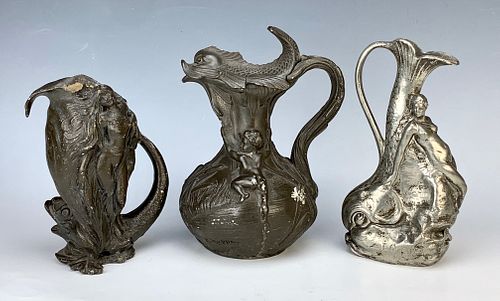 Three Art Nouveau Metal Pitchers C. 1900