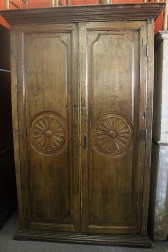 Antique Armoire with Wheel Carving and Iron