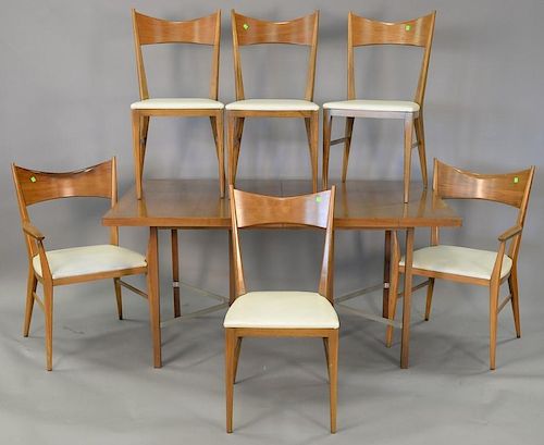 Paul McCobb by Calvin dining table and six chairs. ht. 27", wd. 38", with two 15" leaves.
