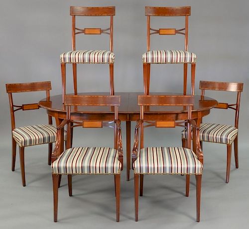 Margolis seven piece dining set to include six chairs and an oval table with three 12" leaves and pads (very slight seperation to to...