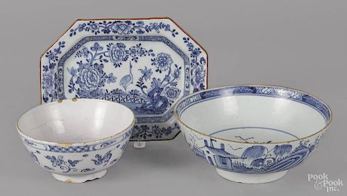 Two Delft blue and white bowls, 18th c., 4'' h., 10 1/2'' dia. and 3 3/4'' h., 7 3/4'' w.