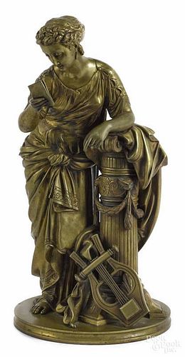 French bronze figure of a woman, late 19th c., standing at a pedestal with a book and lyre