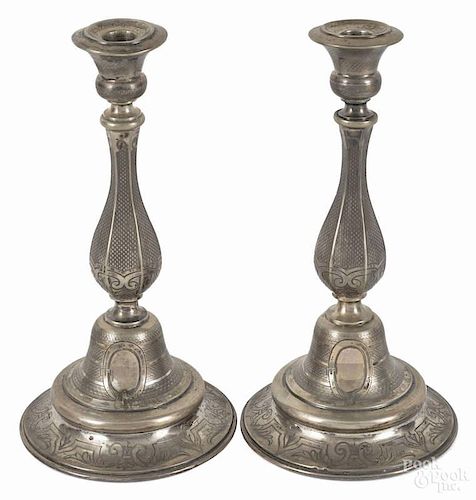 Pair of Eastern European silver candlesticks, 19th c., with engraved latticework