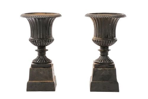 Pair Of Small Iron Gadrooned Garden Urns On Stands