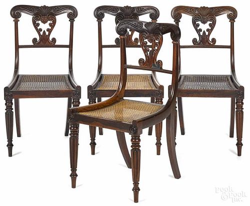 Set of four English Regency rosewood dining chairs, ca. 1830, with cane seats.