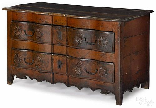 Regence walnut commode, late 18th c., with a red painted surface, 30'' h., 51'' w.
