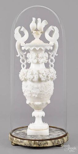 Intricately carved alabaster urn, late 19th c., with a love bird finial and griffin handles