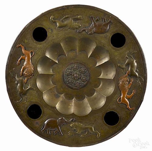 Asian brass charger, late 19th c., with embossed and copper mounted scenes of wild beasts