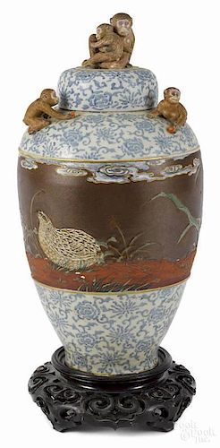 Unusual Japanese Meiji Period porcelain vase and cover with applied monkeys around the lid
