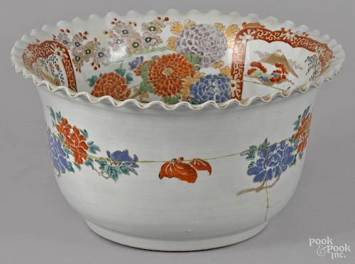 Large Japanese porcelain centerpiece bowl, 19th c., with a coggled rim, 8 1/4'' h., 15'' w.