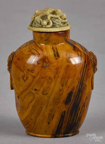 Chinese amber snuff bottle, 19th c., with carved mask handles, 2 3/4'' h.