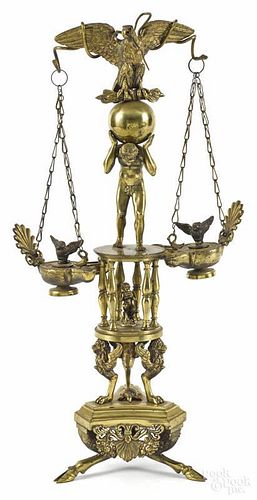Figural brass table lamp, ca. 1900, with an eagle above a figure of Atlas