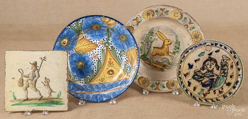 Three Continental pottery plates, 19th c., largest - 12 1/4'' dia., together with a pottery tile