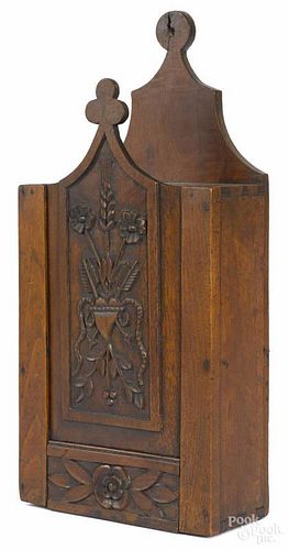 French walnut hanging candlebox, early 19th c., the slide lid with carved floral decoration