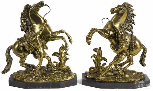 Pair of French bronze equestrian groups, after Coustou, 15'' h.