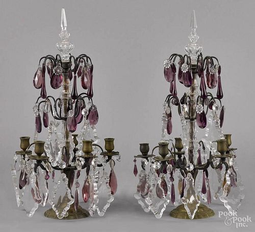Pair of brass candelabra, late 19th c., with colorless and amethyst glass drop pendants